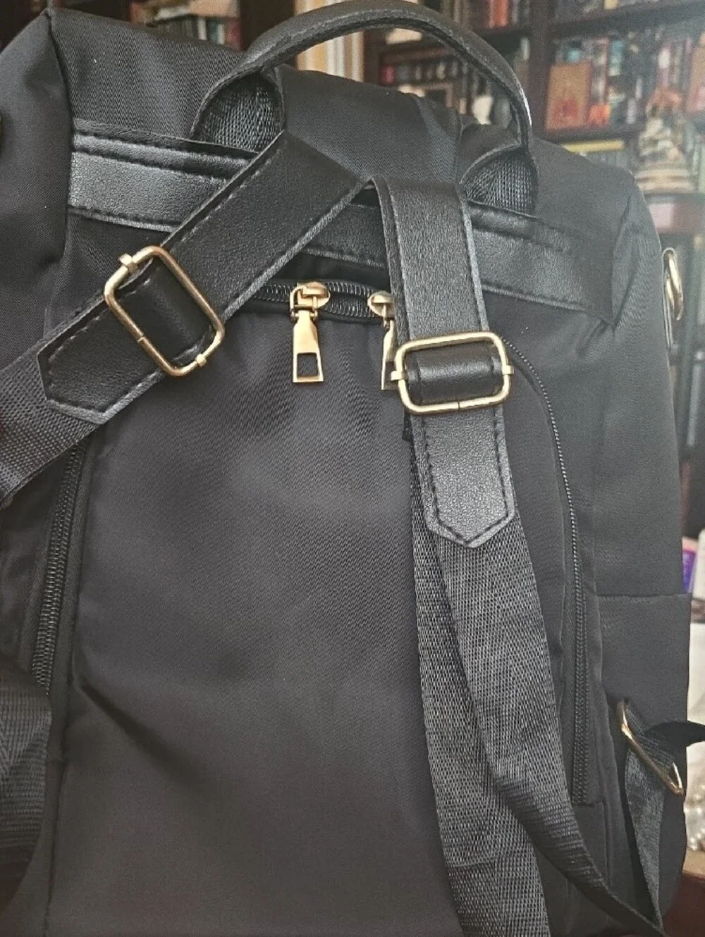 Black Nylon Backpack Bag with Gold Accents Safe And Stylish Travel